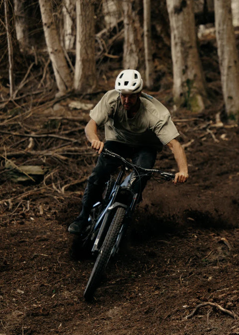 Person riding an electric mountain bike downhill